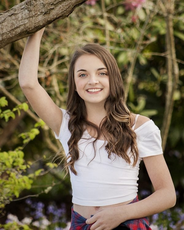 Portrait of a teen girl in summer clothes in a natural setting
