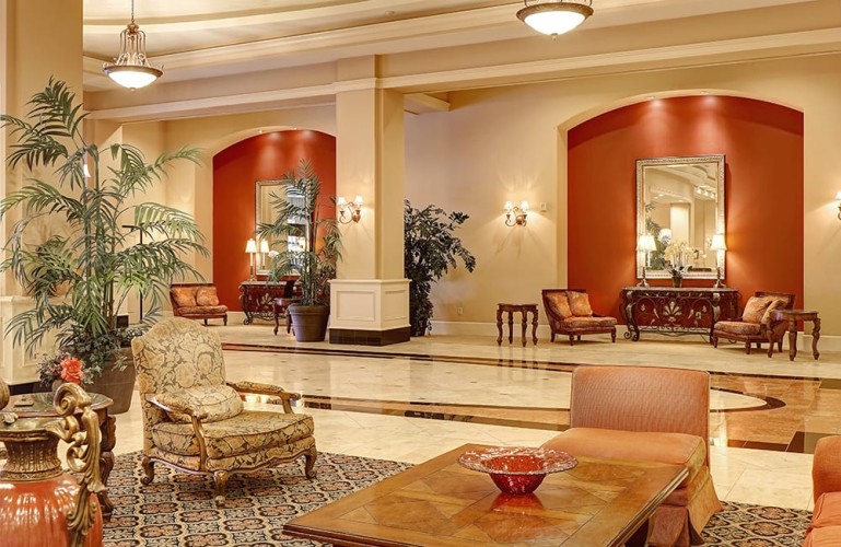 Entryway and lobby of large hotel with luxurious furnishings