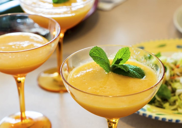 Mimosas each with a sprig of mint