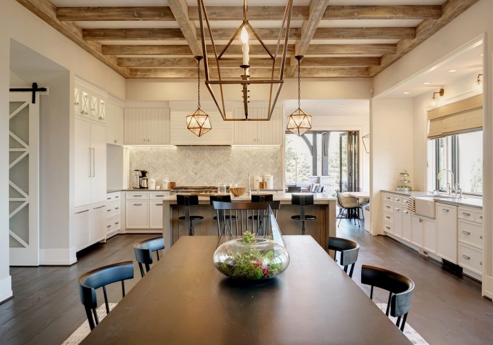 Dining room looking into the kitchen with a light and natural design
