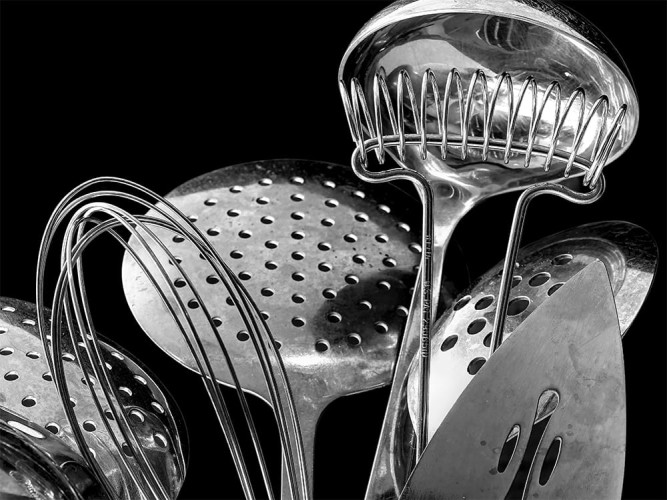 Close up black and white of kitchen utensils