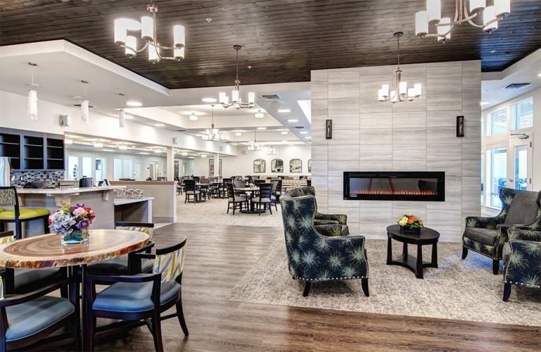 Entrance/lobby with chic seating and a view into the dining room
