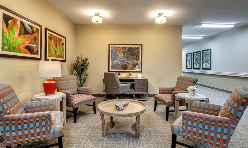 Seating area with orange, blue, and gray accent colors