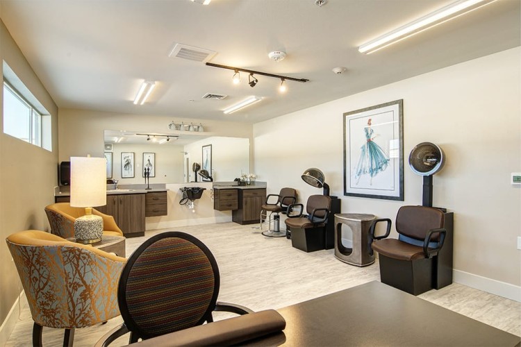 Hair salon with brown, orange, and blue accent colors and simple but elegant furnishings