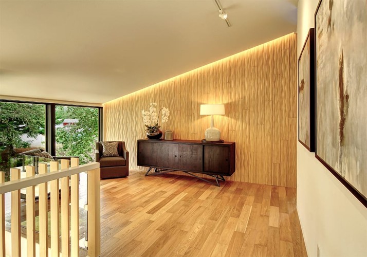 Small loft area with slanted ceiling with a seating area