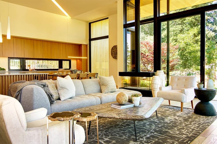 Living room with simple but elegant furnishings looking out into nature