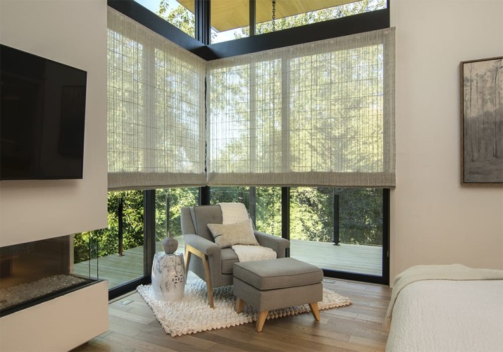 Corner area of a bedroom with a fireplace