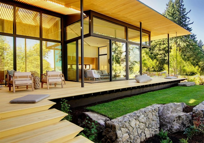 Outside looking towards the living room through the floor to ceiling windows