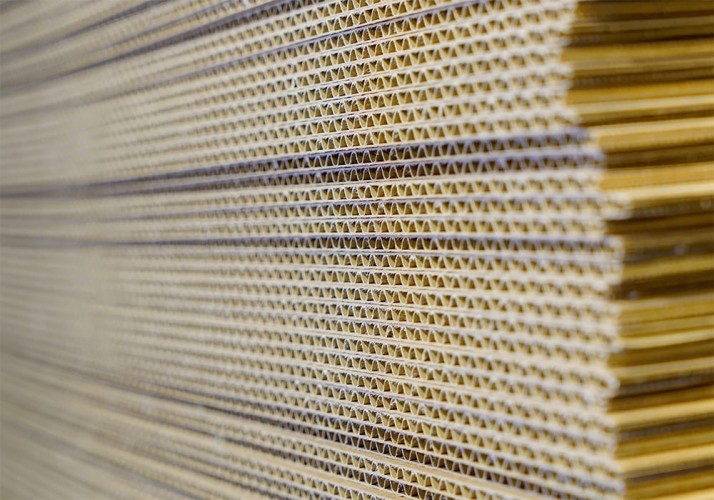 Close up of Ecorrcrate's cardboard stacked all the same direction