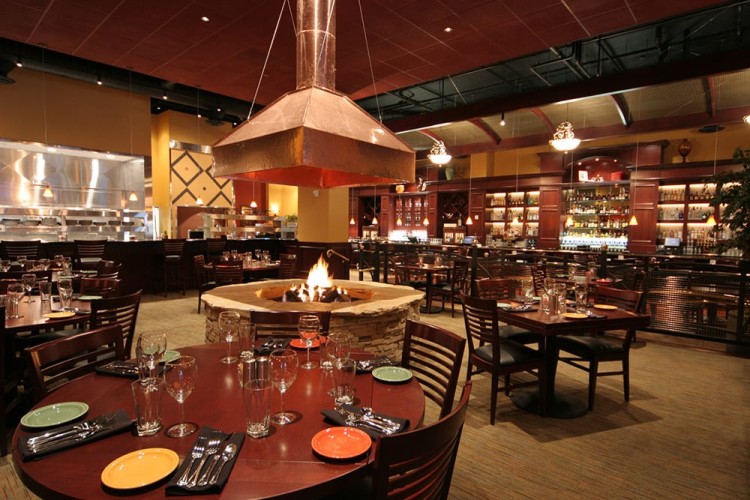 Bentley's Lounge Bar Interior with bar, seating, and middle fire pit